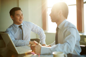 Portrait of smart businessmen discussing new ideas at meeting