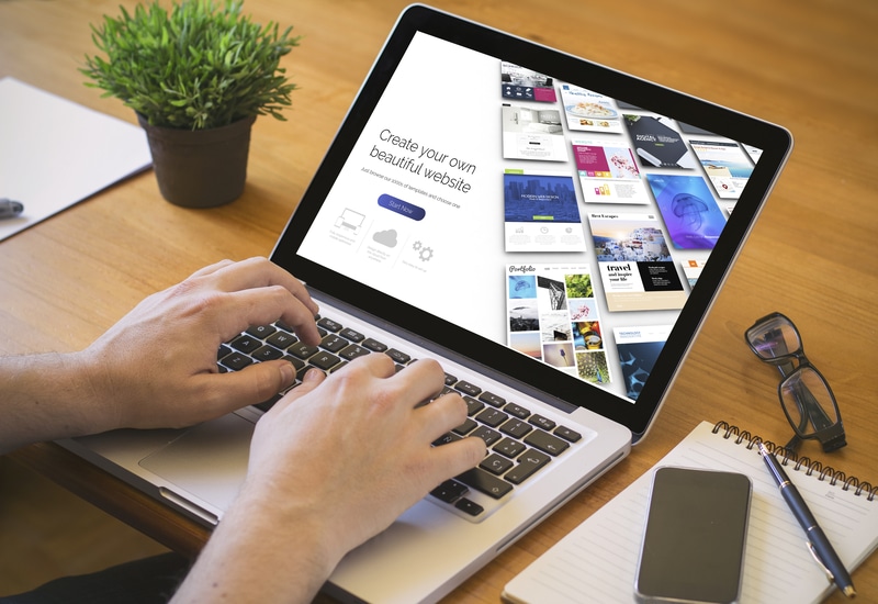 Laptop displaying "how to create a beautiful website"