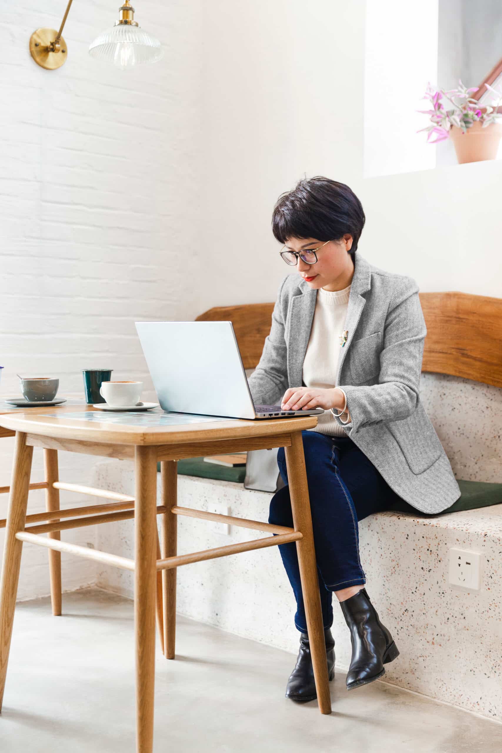 Person sitting in front of laptop