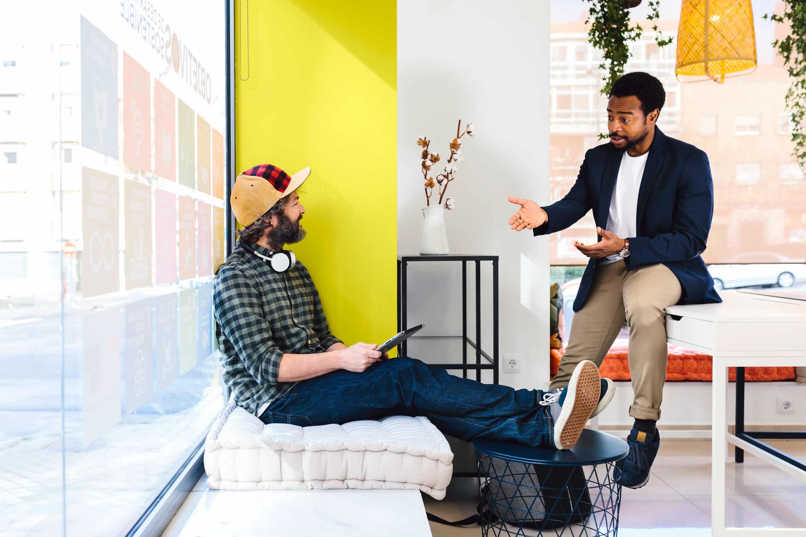 Two people talking in office setting