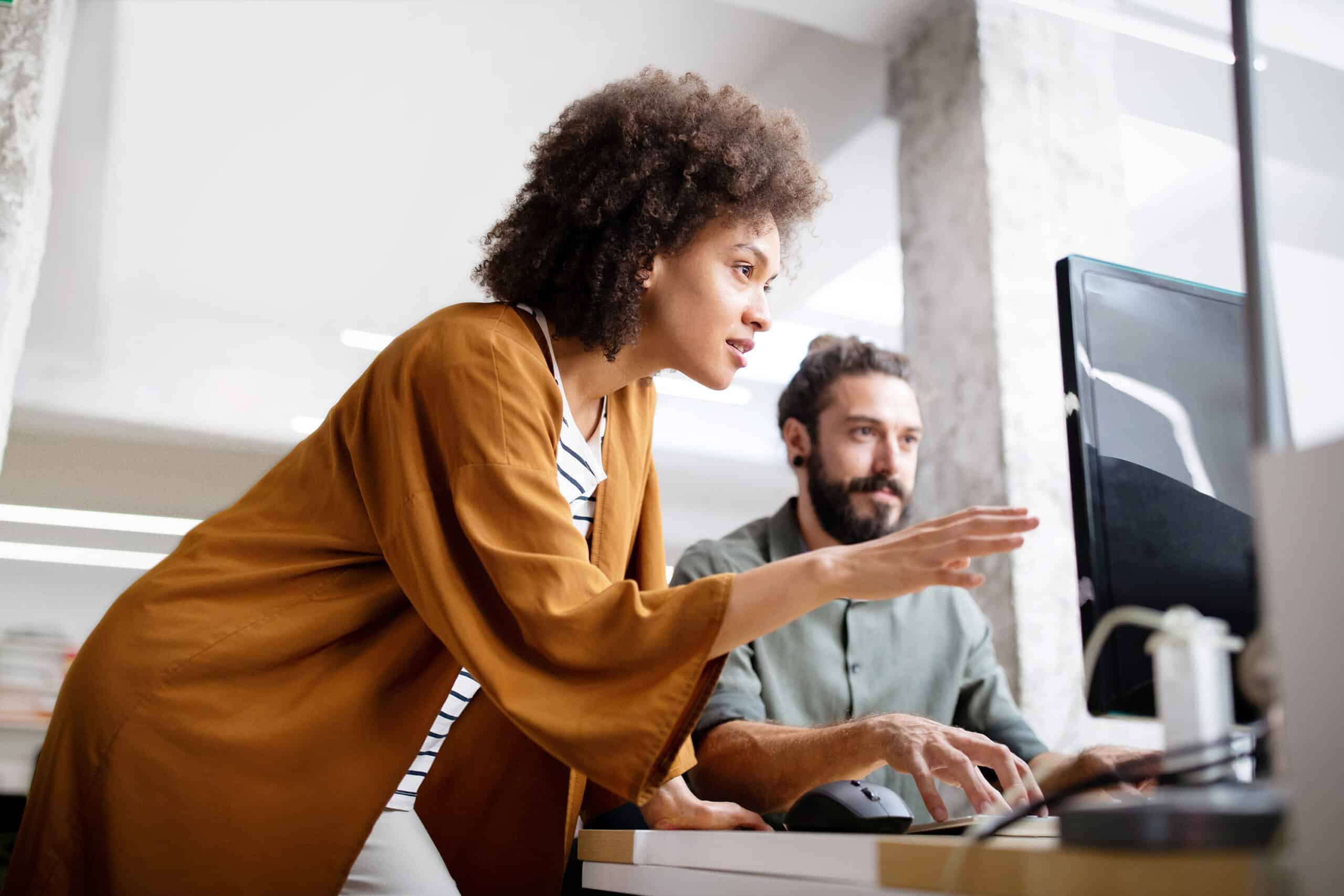 Two people in front of a computer
