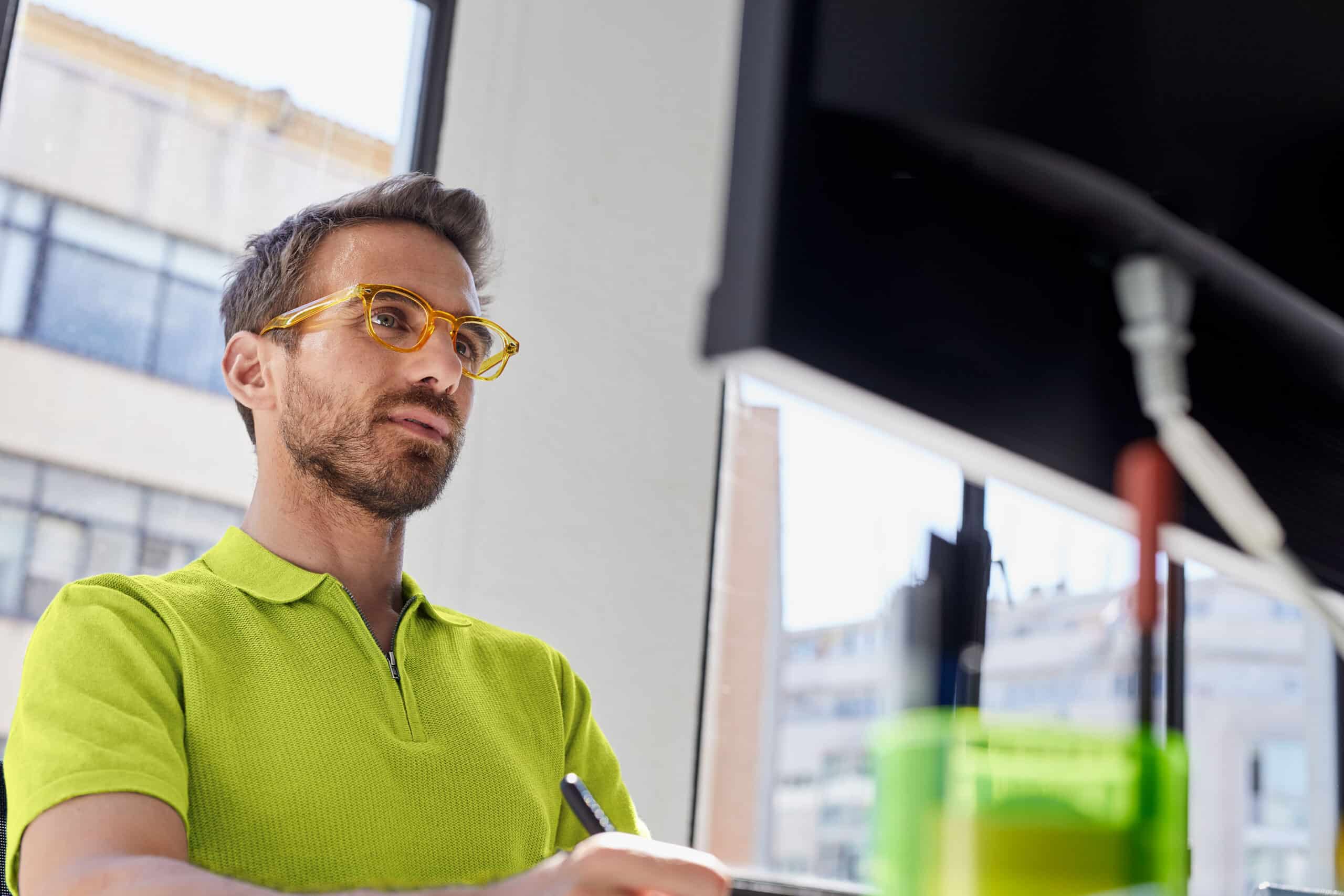 person in front of desktop screen