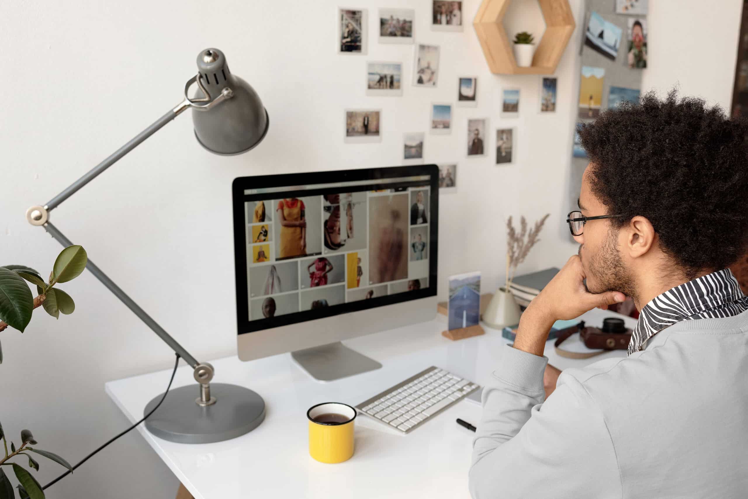 Person in front of computer screen with illustrations 