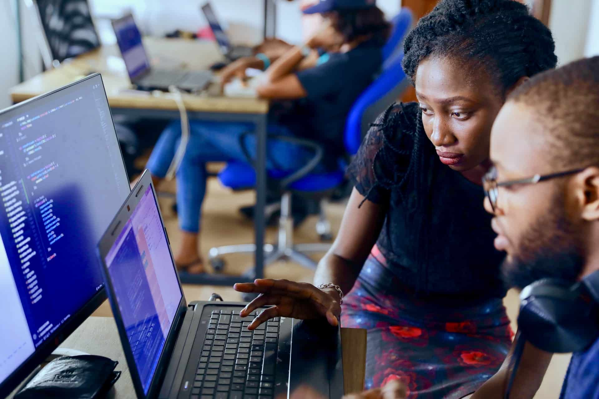 two people looking at computer screens